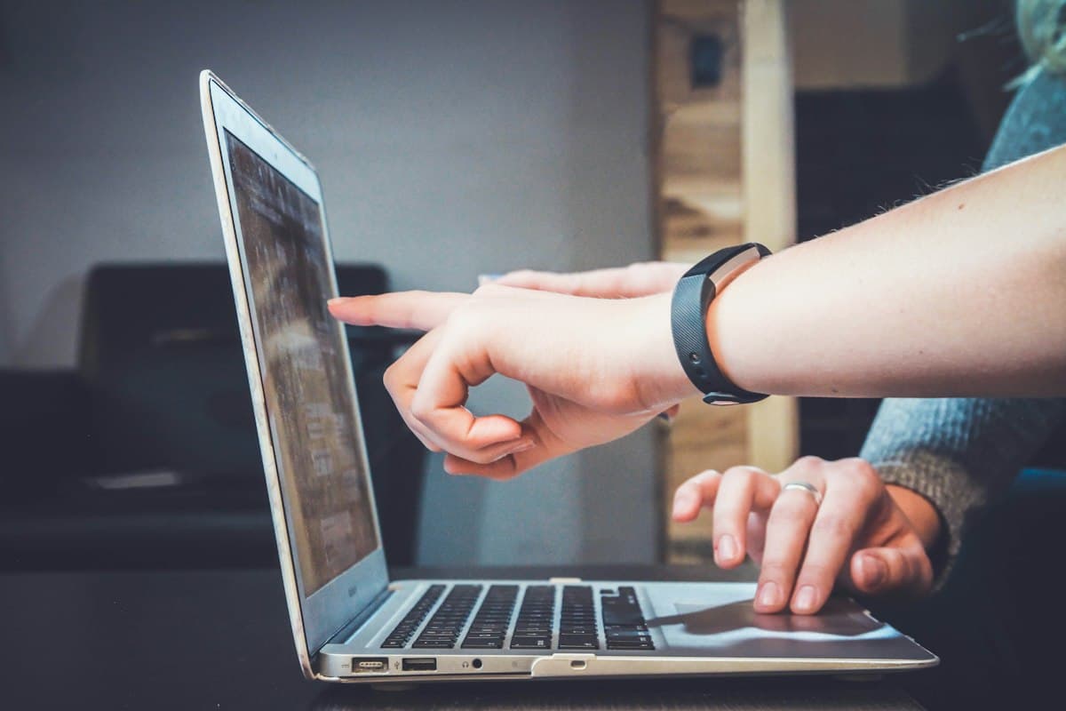 Students reviewing information together on a laptop
